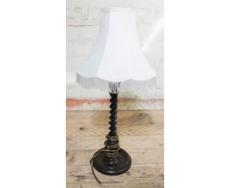 A 1920s twist oak table lamp with shade, height 57cm. 