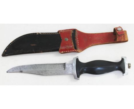 A German Third Reich trench knife with leather scabbard.