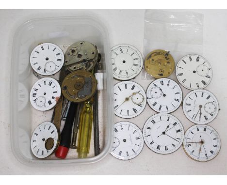 A tub of antique pocket watch movements and some tools. 
