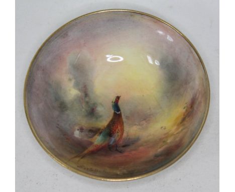 A Royal Worcester dish decorated with a cock and hen pheasant, signed Jas Stinton, numbered 2769, diam. 10.5cm. 