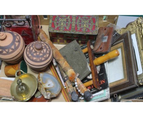 A box of misc. including old photographs in frames, a military arm band, a mother of pearl crucifix, a treen box, a vintage b
