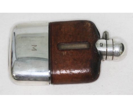 A silver plated and leather bound hip flask, length 11.5cm. 