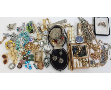 A quantity of antique and later costume jewellery, including a pair of Victorian aesthetic earrings, a hallmarked silver bang