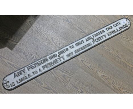 An antique LNER cast metal gate notice - 'ANY PERSON who omits to shut and fasten this gate is liable to a PENALTY not exceed