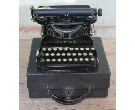 A Corona portable typewriter with case. 