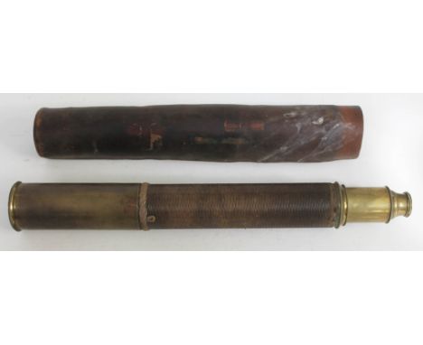 A single drawer woven bound brass telescope with leather case. 