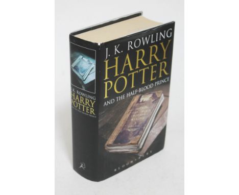 A first edition hardback copy of Harry Potter and the Half Blood Prince with printing error on page 99. 