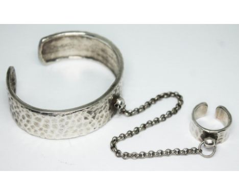 A vintage hammered pewter bangle and ring with linked chain by Scooter Paris, numbered '52' and marked 'Scooter Paris'. 