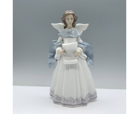 An angel in a white robe, adorned with a large light blue scarf, prepares to read a scroll. Glazed finish. Lladro backstamp. 