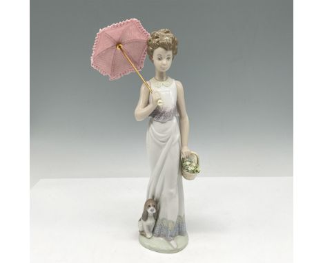 Depicts a woman in a white sun dress carrying a basket of flowers alongside her dog while holding a parasol. Signed by Artist