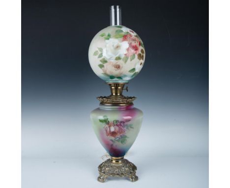 Hand painted floral design colored in plum, green, white and red on translucent ceramic. Base set on brass stand. Twist switc