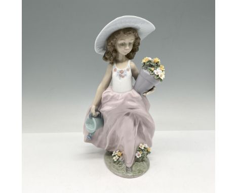 Glossy figure holding pot of flowers and watering can. Colored in gray, blue and pink. Lladro backstamp. This item has its or