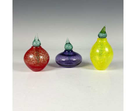 Three hand blown red, yellow, and purple glass bottles with green toppers in the shape of fruits. Etched signature by Gunner 