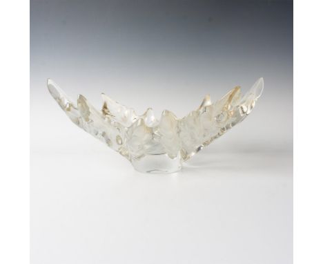 A stunning clear and frosted bowl formed as rows of engraved leaves. The bowl captures the beauty of nature and Paris. Laliqu
