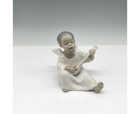 A glossy figure of an angel playing a guitar. Lladro backstamp. This item has its original box: 8"L x 5.5"W x 5"H. Artist: Fu