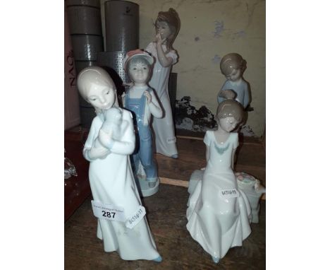 Three Nao and two Lladro figurines. 