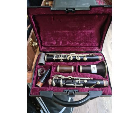 An early 20th century French Buisson nickel mounted rosewood clarinet in associated case. 