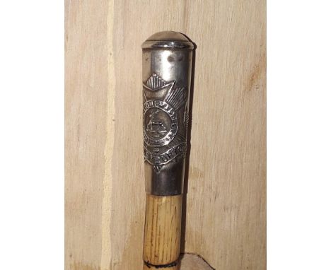 A Haileybury regimental swagger stick. 