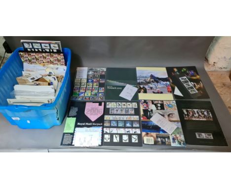 A box of various first day covers, Royal Mail stamp year packs and loose stamps etc. 