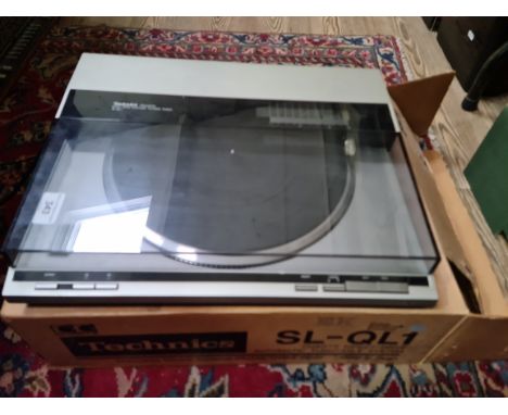 A Technics SL-QL1 turntable.Condition:- some light scratches and marks to metallic finish but no blistering, no sign of any m