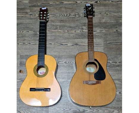 A Yamaha F-340 steel strung acoustic guitar and a Stagg C542nylon strung guitar.Marks / scratches in places, on both guitars,