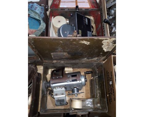 Two bus conductor ticket machines with metal cases. 