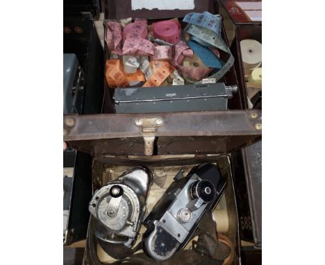 Three bus conductor ticket machines, two cases and various unused tickets. 