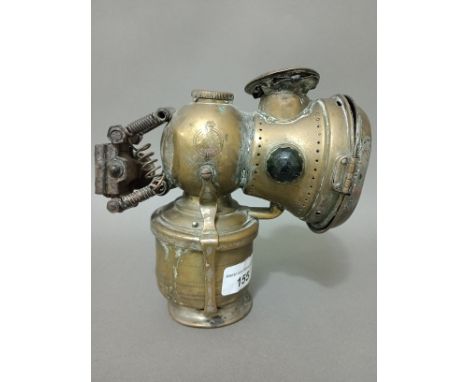 An early 20th century Lucas Ltd patent brass carbide cycle lamp. 