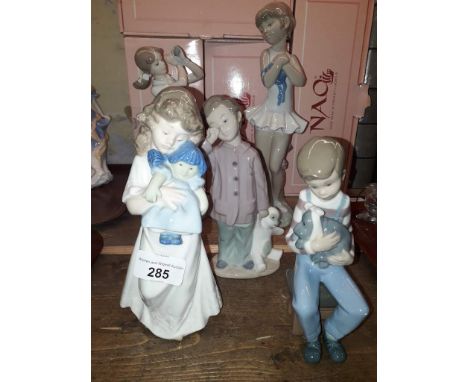 Five Nao figures to include ballerina, tennis player - missing the racket, boy with teddy bear, boy holding dog and girl with