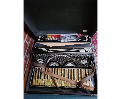 A Cardinal Grand piano accordion in case. 