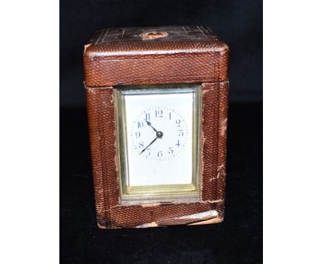 AN EDWARDIAN BRASS CASED CARRIAGE CLOCK  with repeat mechanism, the enamel dial with Arabic numerals, striking the hours and 