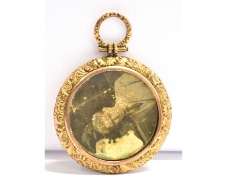 AN EARLY 20th CENTURY REVERSE PHOTO LOCKET/FOB The circular locket mounted in rose and yellow metal with light scratch test i