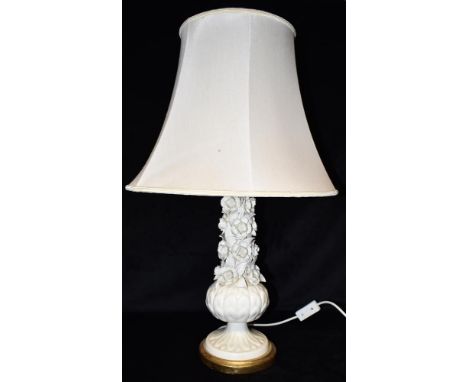 A PORCELAIN TABLE LAMP BASE with floral relief decoration, 38cm high excluding electrical fitting Condition Report : generall