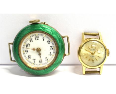 AN 18CT GOLD WATCH HEAD AND AN ENAMELED WHITE METAL WATCH HEAD The 18ct gold watch head marked Desta, 17 jewels to the dial, 