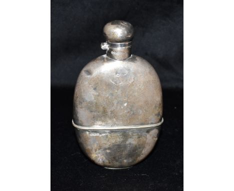 A GEORGE V SILVER HIP FLASK Hallmarked for Sheffield 1910, 16cm long, weight 268g, 8.6 Troy oz Condition: Some dents and scra