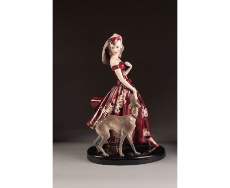 A GOOD 1930's AUSTRIAN GOLDSCHEIDER PORCELAIN FIGURE of young woman holding a parasol wearing a flowing floriated magenta dre