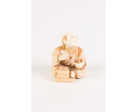 GOOD JAPANESE MEIJI PERIOD CARVED AND, IN PART, LIGHTLY STAINED IVORY NETSUKE OF A SMILING MAN SEATED CROSS-LEGGED eating noo