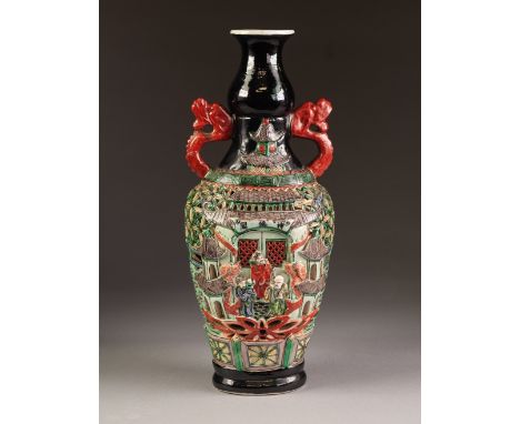 AN INTERESTING CHINESE QING DYNASTY PORCELAIN SLIGHTLY FLATTENED BALUSTER SHAPE BASE with iron red dragon handles, the body r