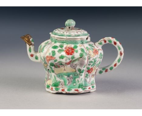 KANG HSI CHINESE FAMILLE VERTE PORCELAIN SMALL TEAPOT AND COVER, with bud finial, the body oval lobed and waisted, 'C' scroll