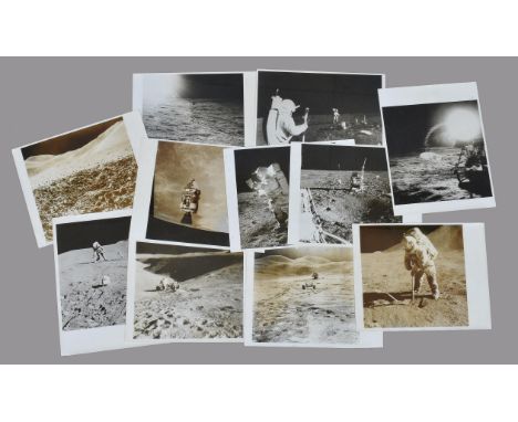 
	
		A group of photographs related to various Apollo missions, including twenty eight vintage press photographs, comprising: