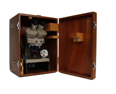 Vickers Instruments binocular microscope with electric field illumination and two W.F. 5X eyepieces, in wooden carry case.