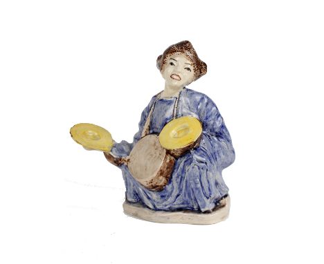 A Chinese ceramic figure of a seated figure. 
