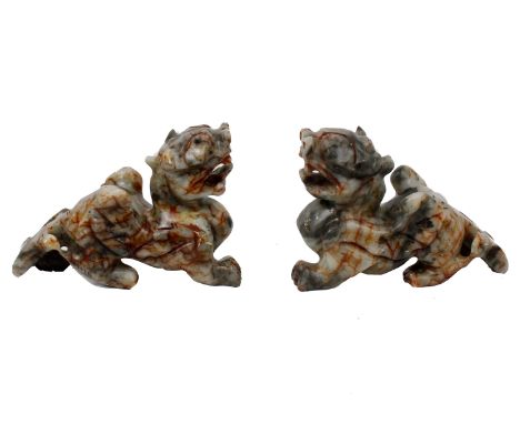 A pair of Oriental carved Jade Lions.