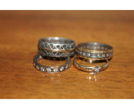 THREE STONE SET ETERNITY RINGS AND A CZ SILVER GILT RING 