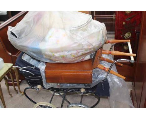 VINTAGE CHURCHILL PRAM
with parasol and blankets, together with a collection of toys including a c.1920s doll, a child's wood