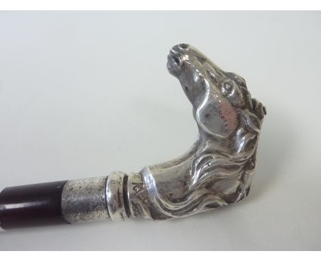 Walking stick with silver handle modelled as two horses heads, marked LA 9810. Condition Report. Has been used but not abused