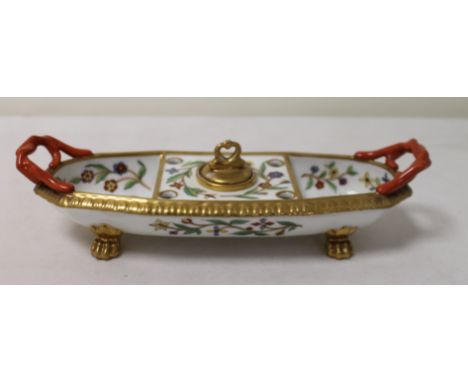 Continental porcelain desk stand of oval form with twin handles and four paw feet, decorated in polychrome and gilt enamel wi