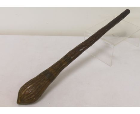 Australian Aboriginal club or "Waddy" of tapered form with incised linear decoration. 44cm long. (Varnished)