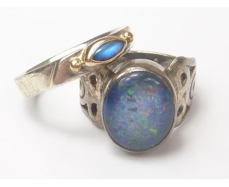 Opal doublet ring and another with moonstone in silver and gold. (2)