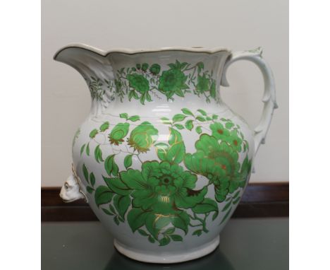 W.E. and Co. patent Granite China ewer with green and gilt floral decoration, 29cm high. Condition Report. Discoloured porous